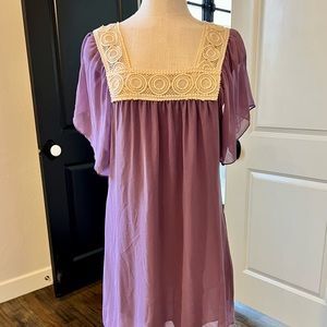 Purple chiffon dress with cream crochet detailing around neckline (Size M)